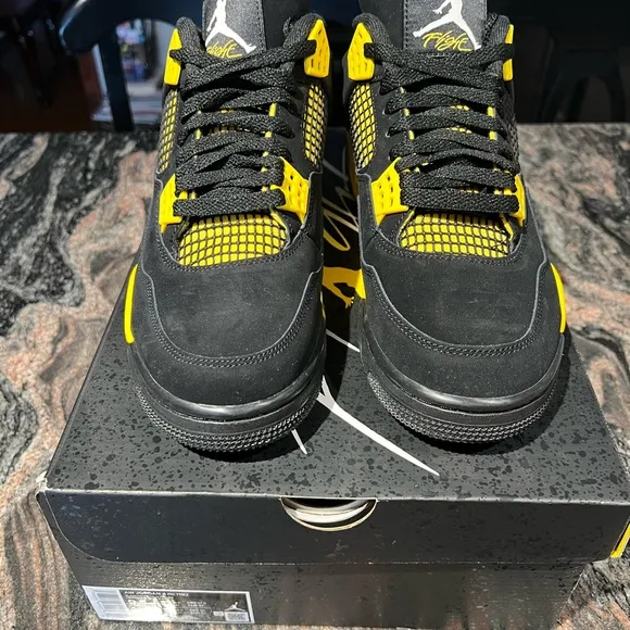 Air Jordan 4 Retro Black and Yellow Thunder Sneakers