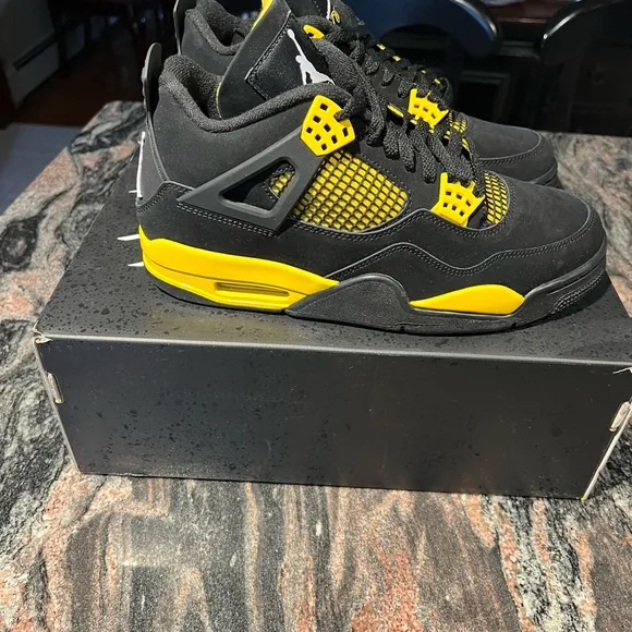 Air Jordan 4 Retro Black and Yellow Thunder Sneakers