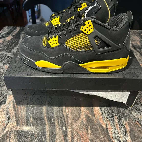 Air Jordan 4 Retro Black and Yellow Thunder Sneakers