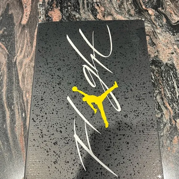 Air Jordan 4 Retro Black and Yellow Thunder Sneakers