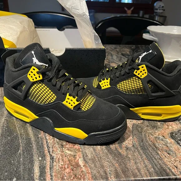Air Jordan 4 Retro Black and Yellow Thunder Sneakers