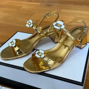 Gold Larroudé Tinx Sandals with Floral Accents - US 7