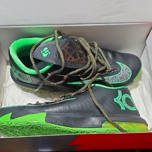 KD. VI  Black and Green Athletic Shoes