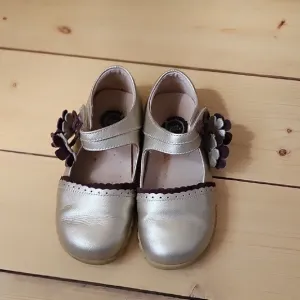 Livie &amp; Luca Gold Dress Shoes with Floral Embellishments