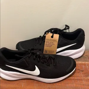 Nike Men’s Revolution Black and White Athletic Shoes